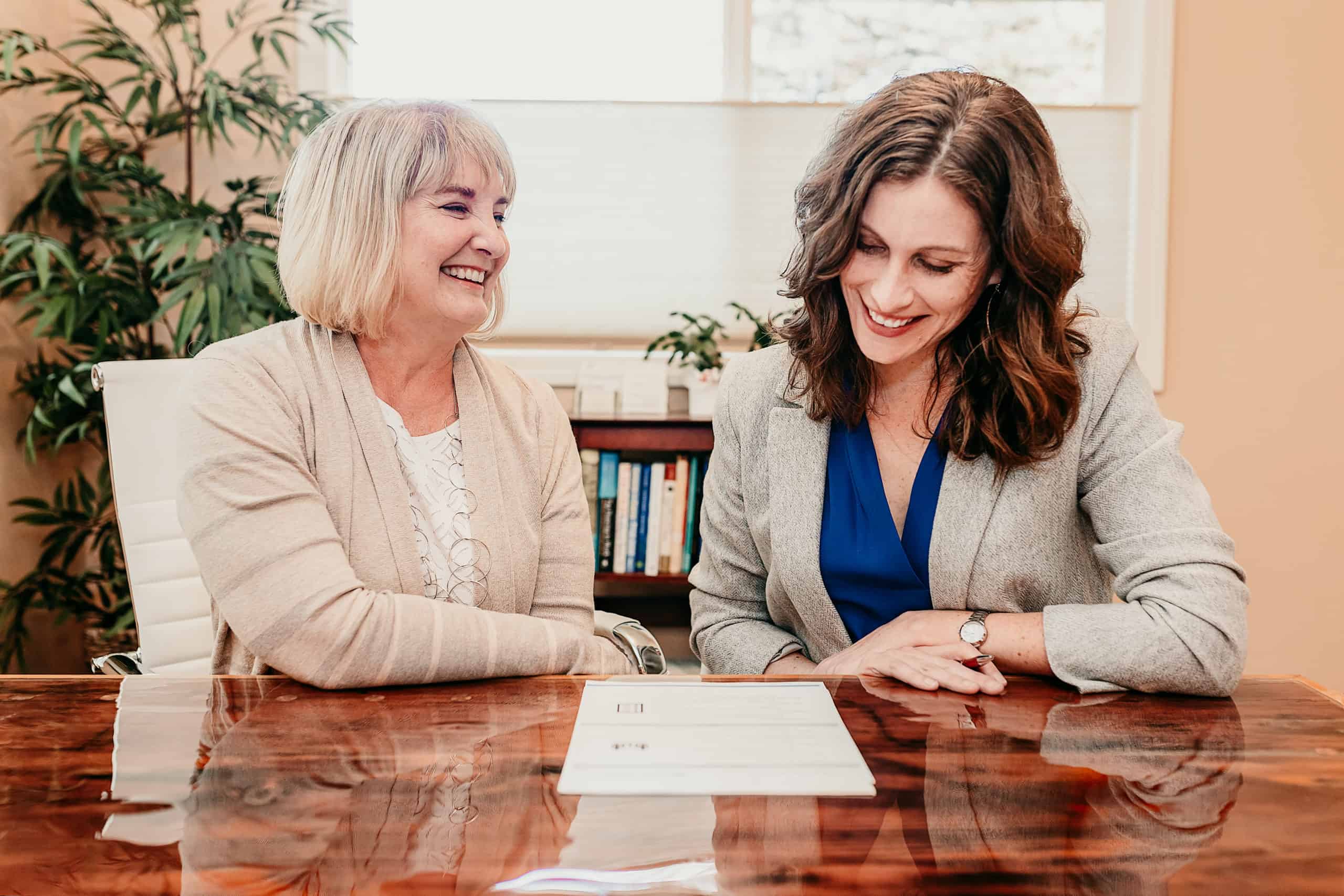 Two Clarity advisors reviewing a financial plan together at a desk
