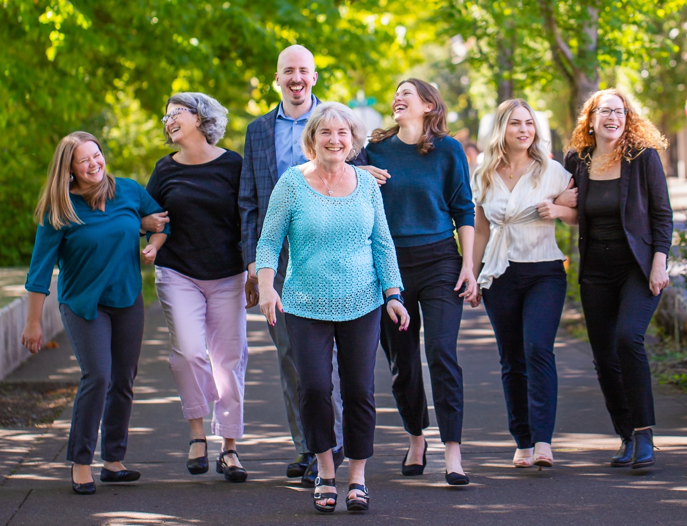 Clarity Wealth Development team walking and laughing together in Corvallis, Oregon