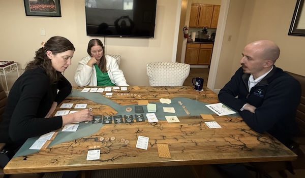 Clarity team playing a board game at lunch
